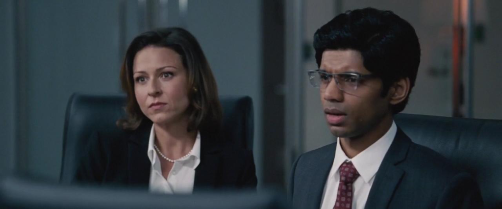 Vanessa Cloke and Rajeev Jacob as Goldman Sachs Employees