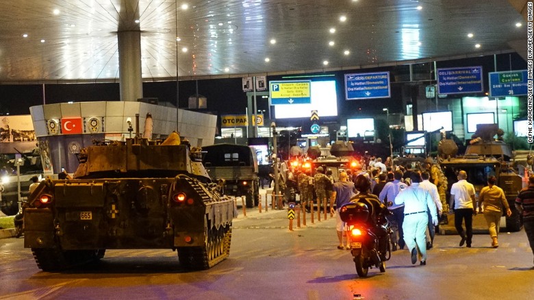 Military vehicles enter Istanbul Ataturk Airport following an attempted coup attempt in Turkey