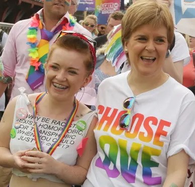 Nicola Sturgeon (right), the Giftzwerg or poison-dwarf of Scottish politics, takes part in minority-worship